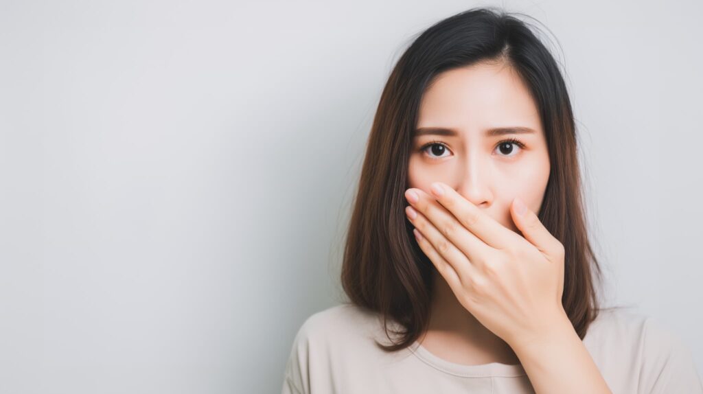 口臭が気になるようになったブリッジ治療後の女性